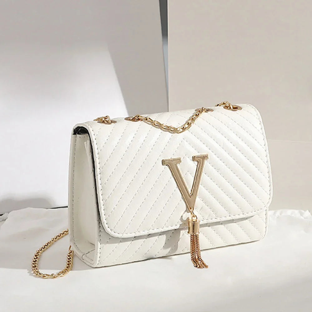 Chevron Quilted "V" Flap Crossbody Bag with Tassel Detail