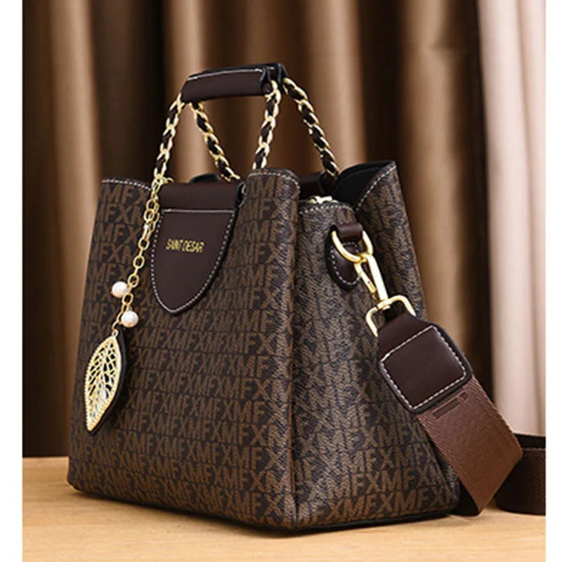 Monogram Satchel – Elegant Top-Handle Bag with Leaf Charm