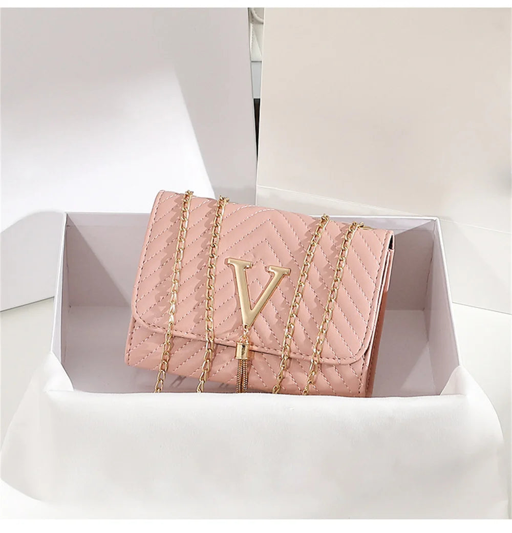 Chevron Quilted "V" Flap Crossbody Bag with Tassel Detail