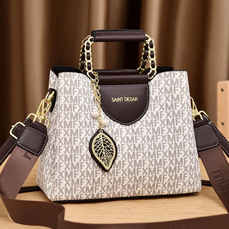 Monogram Satchel – Elegant Top-Handle Bag with Leaf Charm