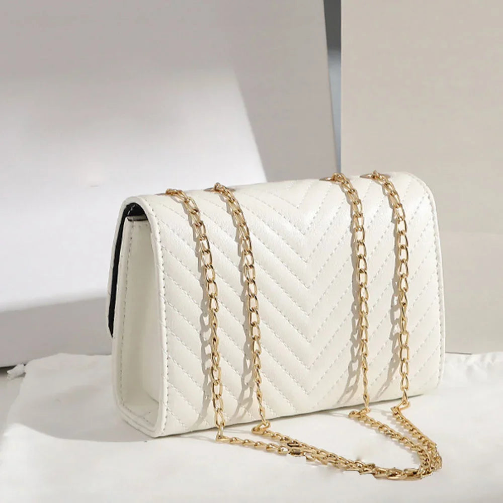 Chevron Quilted "V" Flap Crossbody Bag with Tassel Detail
