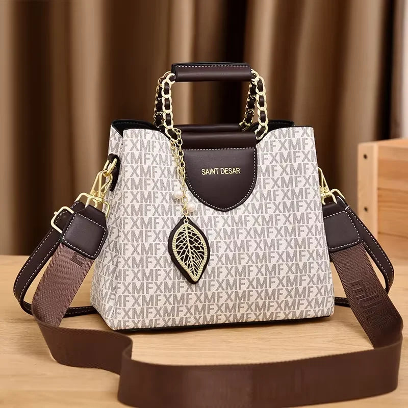 Monogram Satchel – Elegant Top-Handle Bag with Leaf Charm